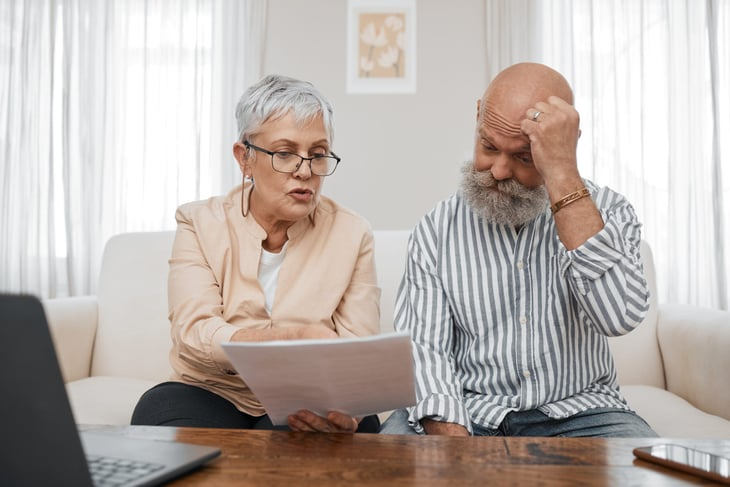 Older couple looking at a laptop
